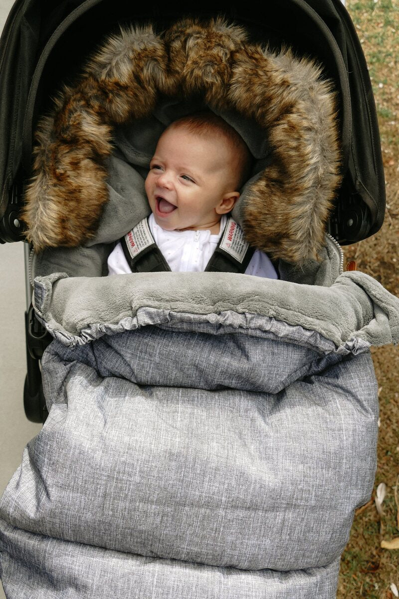 Happy baby in a Brievelo Nordic Footmuff
